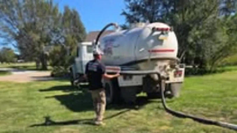 Mike's septic pump truck on a tank pump-out in Saline County